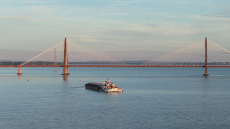 bulk carrier crosses bridge over parana river, international cargo and regional development