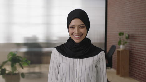 portrait of young muslim woman smiling confident arms crossed enjoying career opportunity in start up business