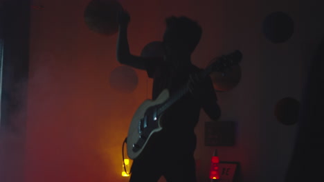 musician performing in a decorated bedroom