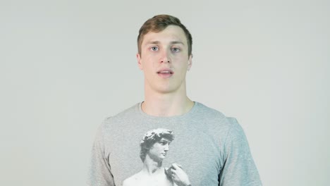 smiling young man in gray t-shirt