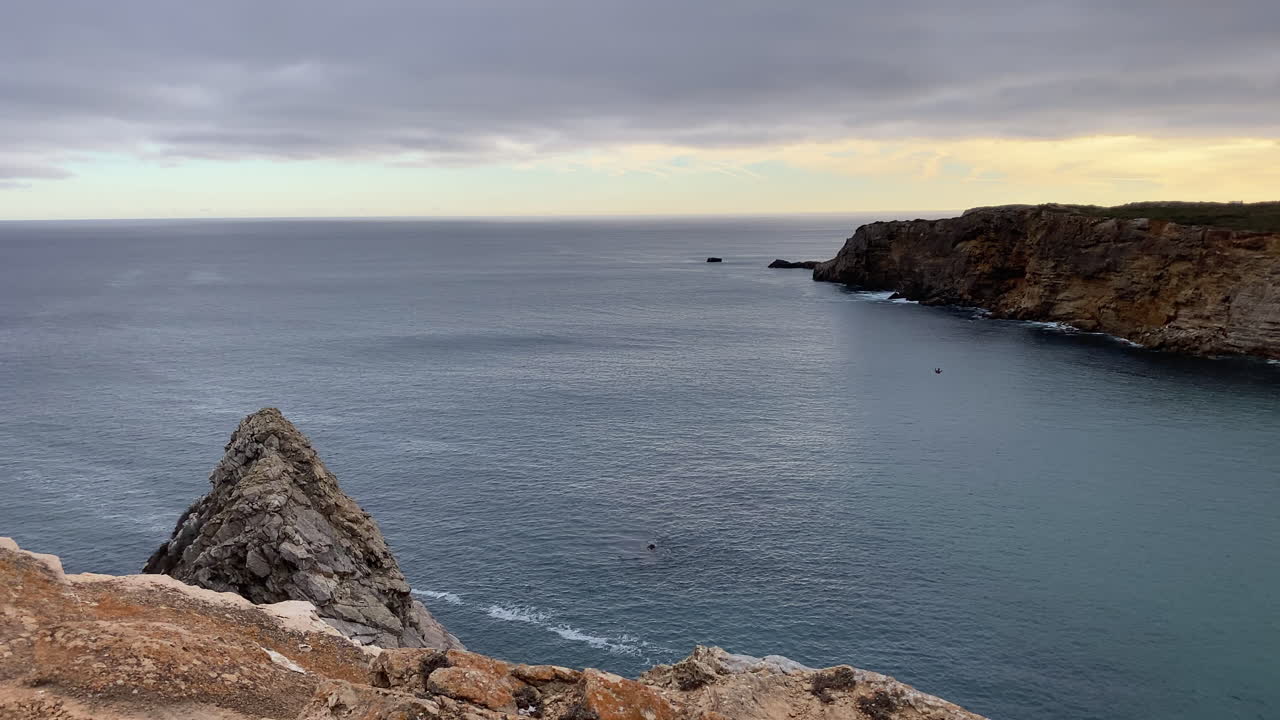 Powerful sunlight washes the coastline, creating a radiant shimmer over Sagres’ wild Atlantic edge