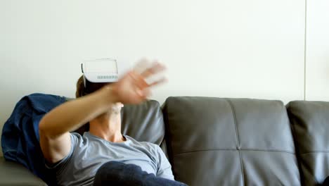 man using virtual reality headset in living room 4k