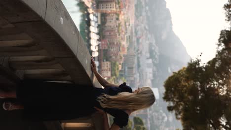 Beautiful-Woman-Modeling-at-Monaco-City-Overlook,-Vertical