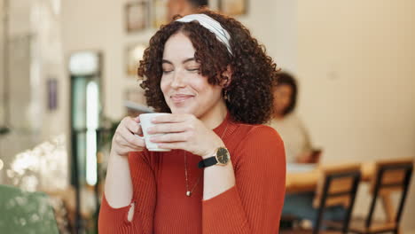 a woman enjoys coffee at a cafe