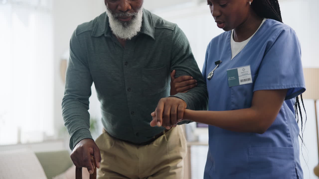 Nurse assisting elderly patient with walking