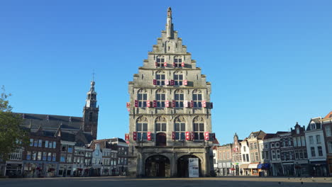 the historic town hall in gouda, netherlands at daytime - wide