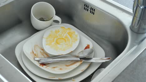 dirty dishes in kitchen sink