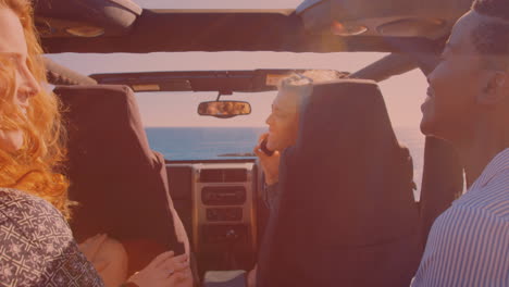 Group-of-diverse-friends-enjoying-in-the-car-during-a-roadtrip