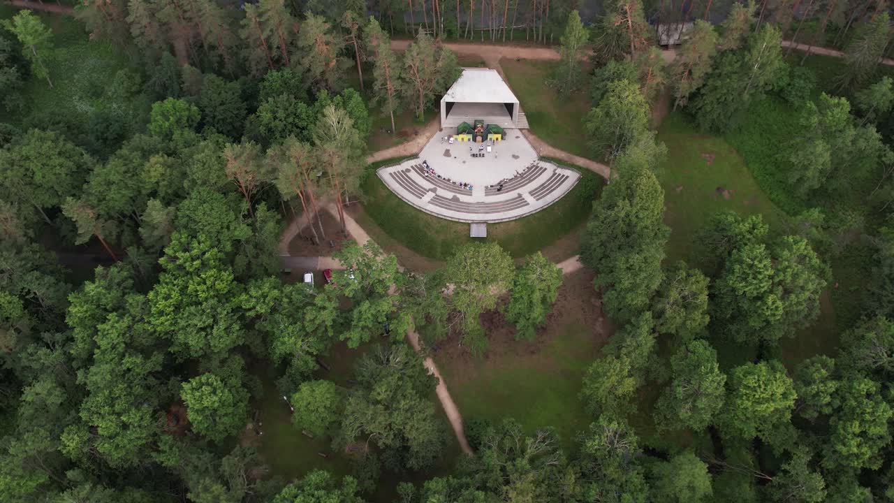 Aerial view of the city of Strenci showing a mix of urban and natural elements. The city is surrounded by lush greenery, with residential buildings