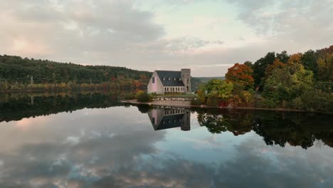 Mirror-Reflections-Of-Old-Stone-Church-In-Wachusett-Reservoir,-West-Boylston,-Massachusetts,-USA