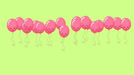 animation of pink balloons with faces bouncing on green background