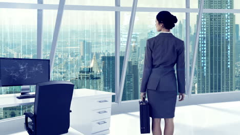 businesswoman looking at digitally generated text and graphic on office window