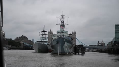 london warship docking at the thames river