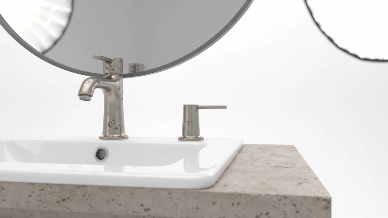 Meuble-lavabo de salle de bain contemporain avec miroir rond et robinet moderne, mis en valeur par un éclairage de studio pour un look épuré et élégant