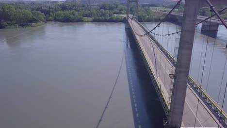 impressive elevated aerial view above pont de roquemaure suspension bridge crossing over rhone river