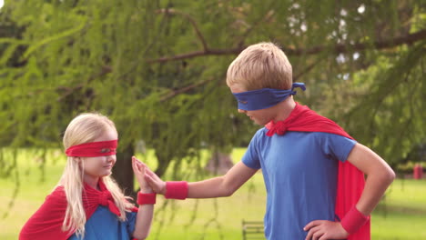 children pretending to be superhero