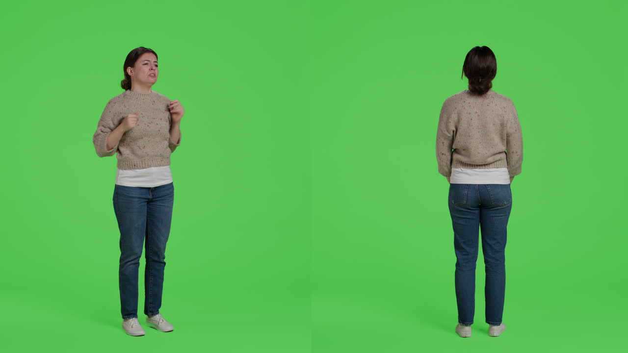 Woman standing in front of a green screen
