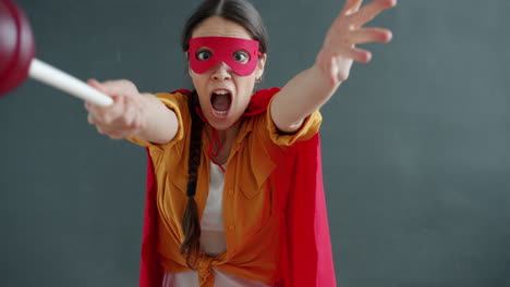 woman dressed as superhero with a lollipop/plumber costume