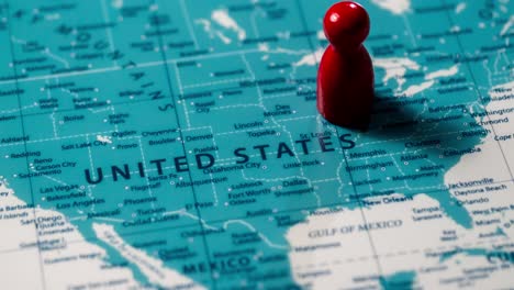 a red figure positioned a map of the united states symbolizes exploration and travel insights.