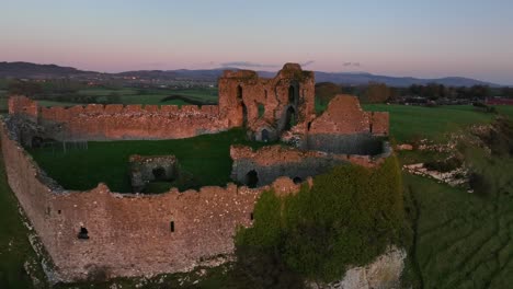 ancient castle ruins at sunset