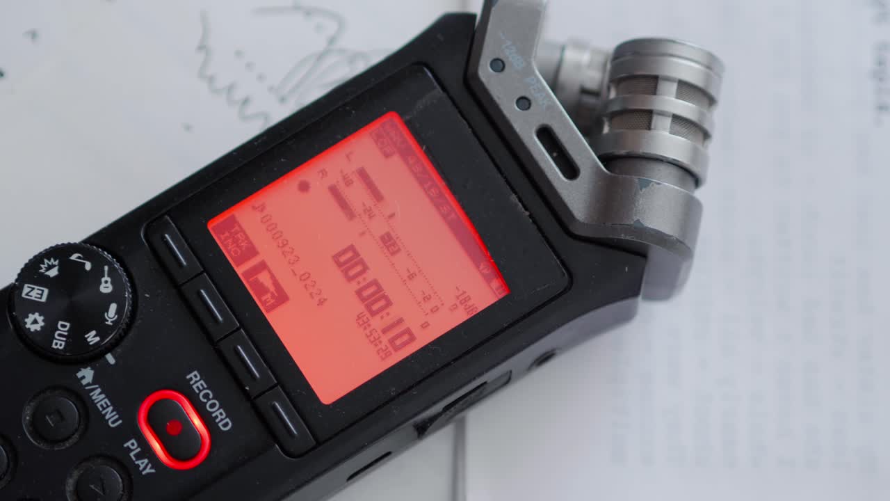 Red audio recording light appears on dictaphone when button activated