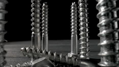 metal screws close-up on dark background