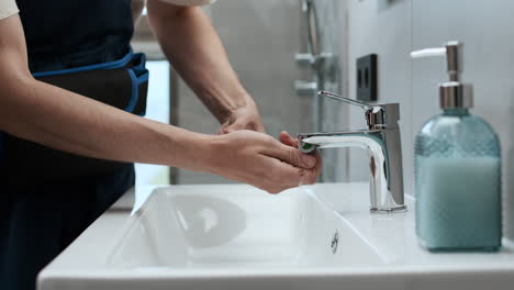 plumber fixing the faucet