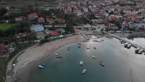 beautiful sunset over the marina and the byzantine tower at nea fokea, halkidiki,greece