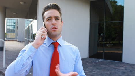 male executive talking on mobile phone 4k