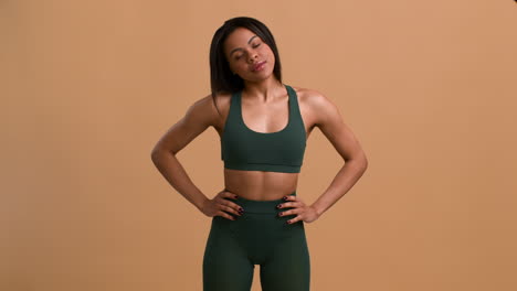 woman in fitness attire, posing for a photo