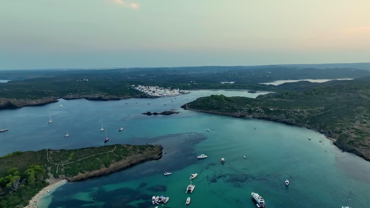 Drone shot of some spectacular scenery of land and water on Menorca, Spain in the Mediterranean sea.