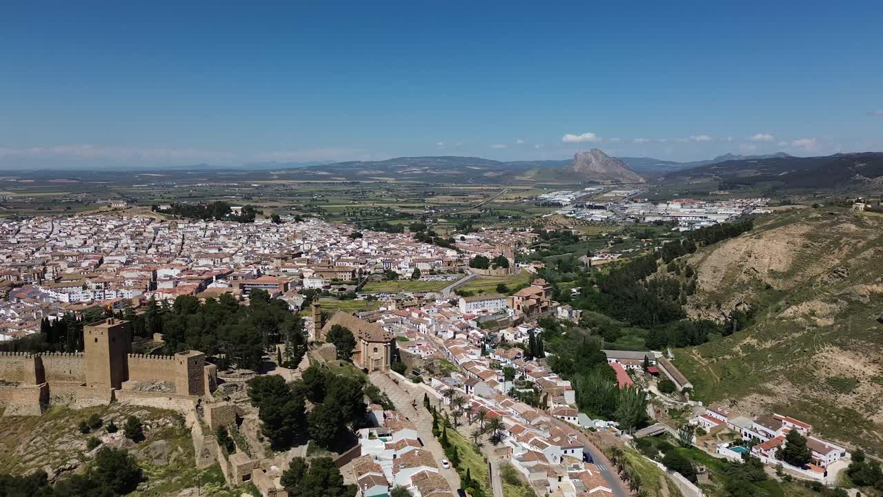 drone footage of Antequera, a historic town in Andalusia, Spain, captured on a clear and sunny day.
