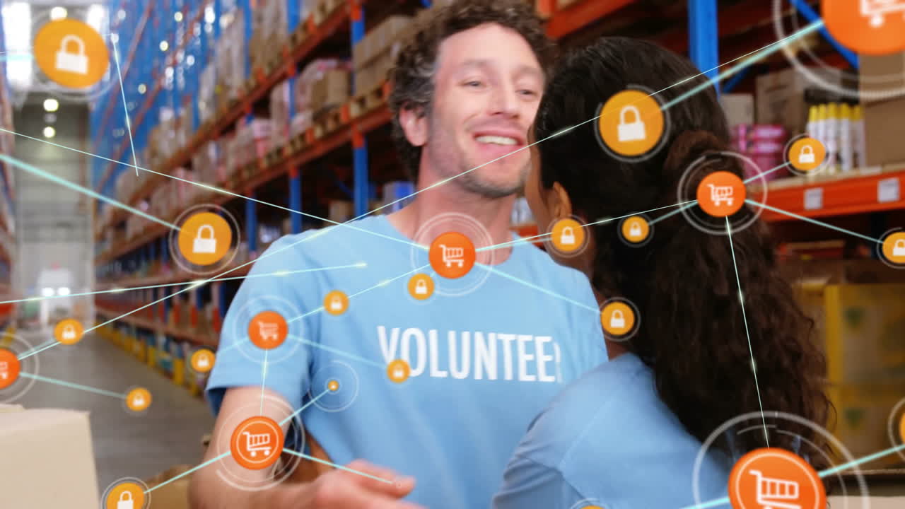 In warehouse, volunteers organizing goods with digital animation of network icons