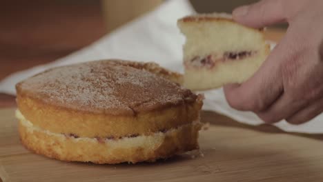 slicing and serving victoria sponge cake close up shot