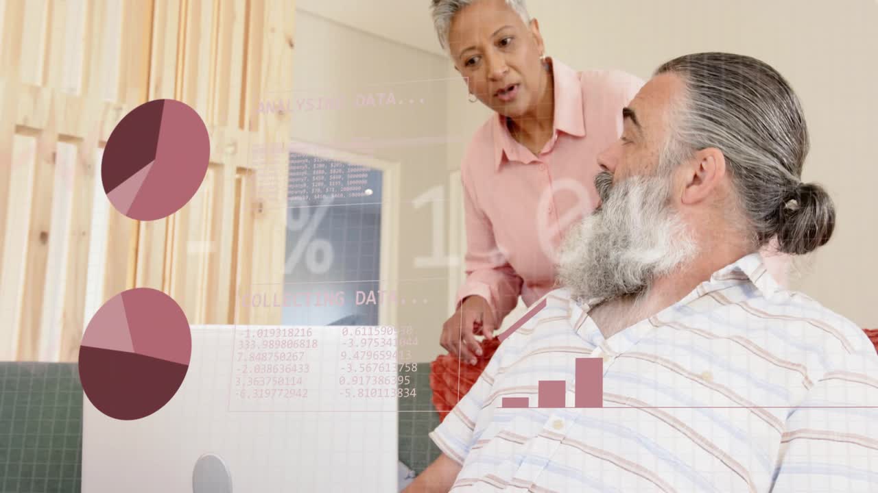 Couple on sofa woman leaning and pointing at laptop causing finance charts moving for retirement