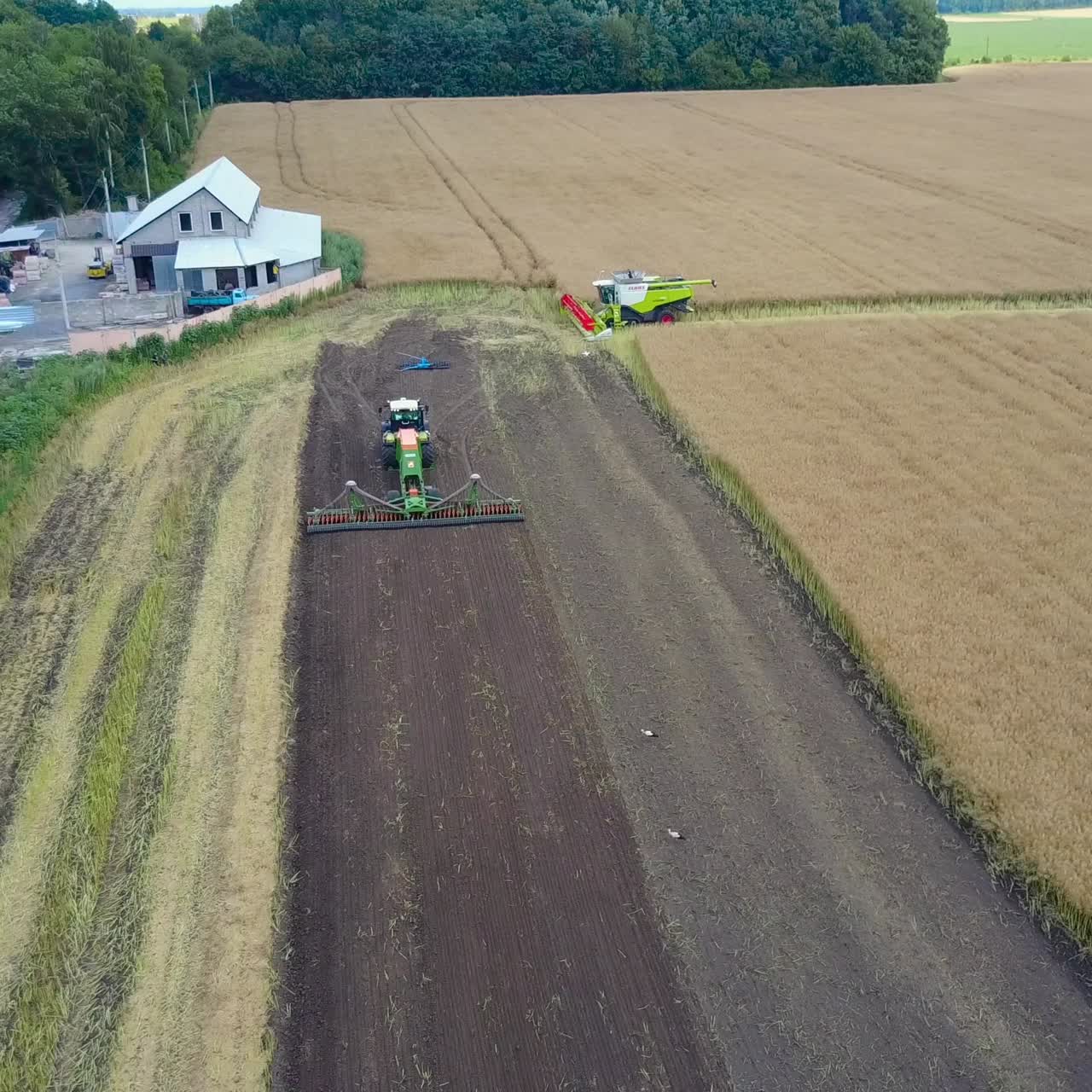 Plow Attached To A Tractor On A Field