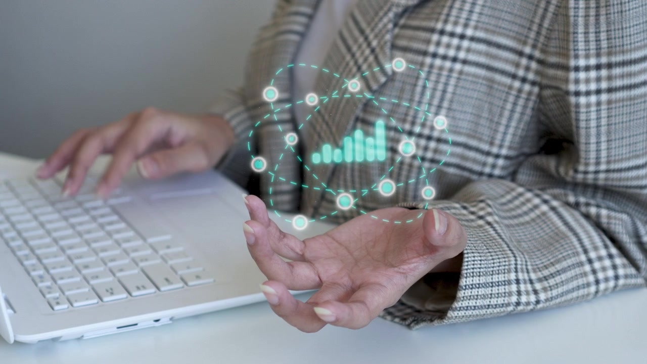 Businesswoman managing interactive data analytics and global connection graphics over hand