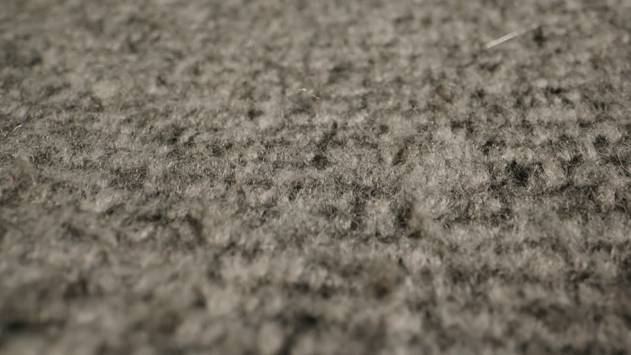 Wool textile cloth texture close-up macro. Woolen background. Fashion fabric multicolor. Sheep wool for clothes