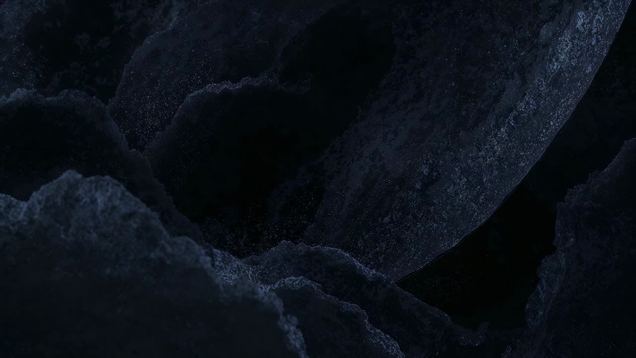 Nudging camera revealing dark porous rock cluster at close-up to reveal surface texture and void