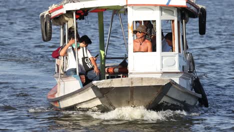 passengers enjoying a boat ride on water