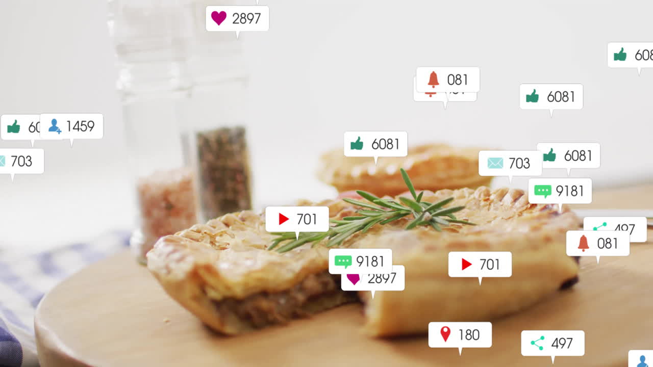 Animation of savory pies on table with social media notification icons floating