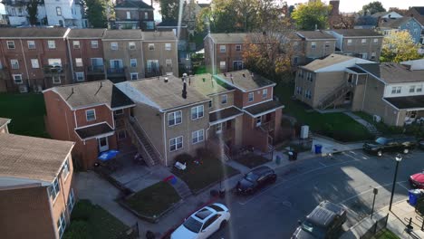 Townhouse-complex-with-brick-facades-and-parked-cars