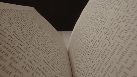 probe lens floating over a book that is being opened