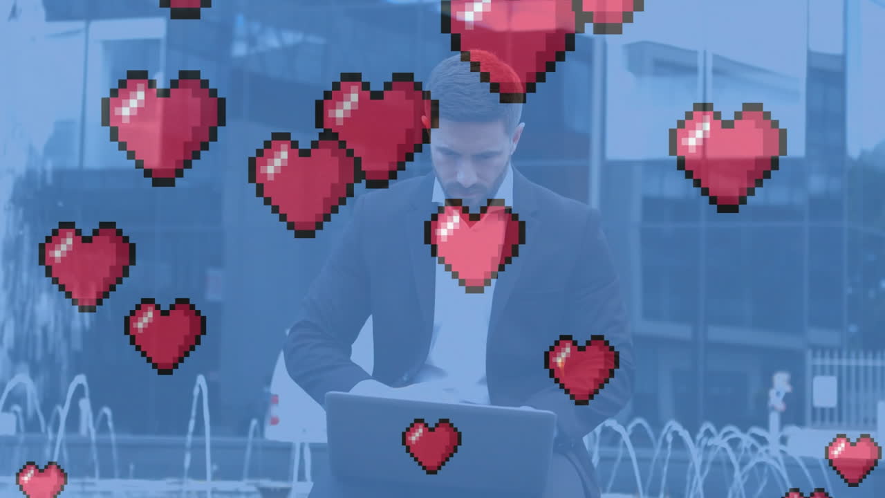 노트북을 사용하는 백인 사업가에 대한 심장 아이콘의 애니메이션