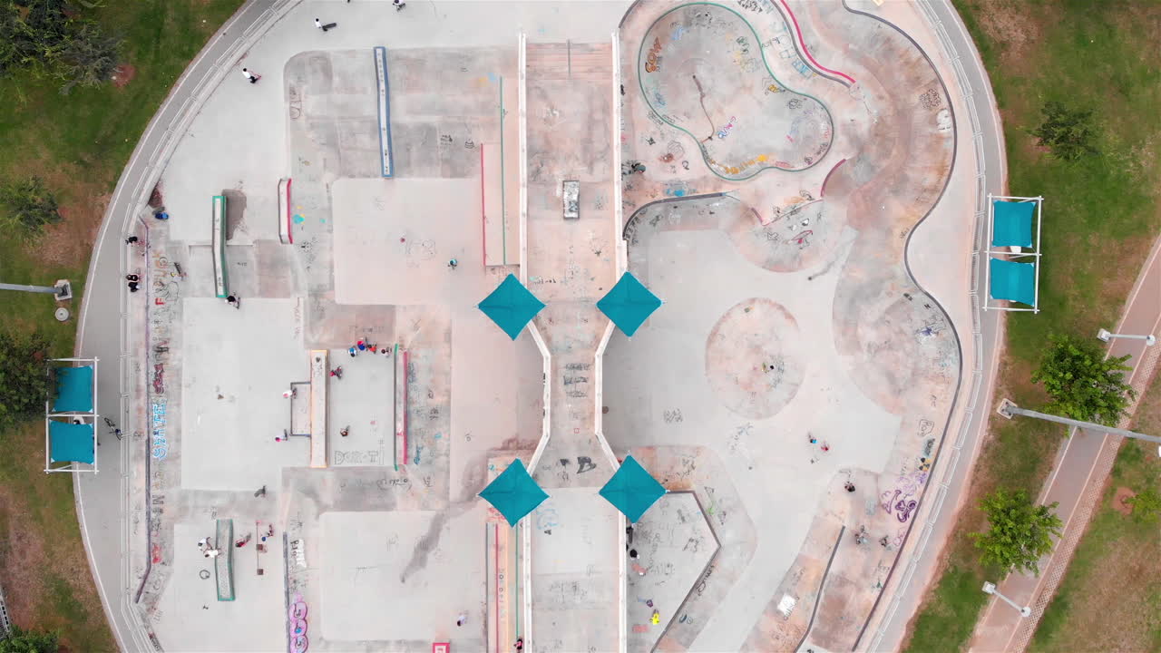 Drone footage Above Skatepark with People Skating