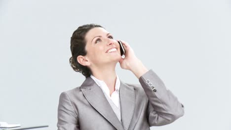 Enthusiastic-businesswoman-talking-on-phone