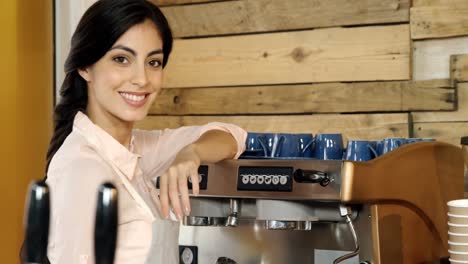 female waitress cleaning coffeemaker in cafe 4k