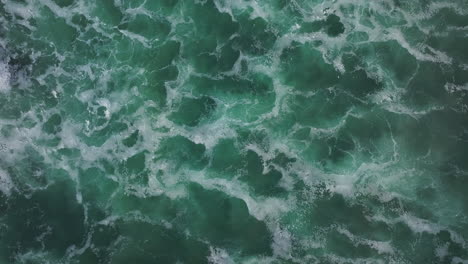 aerial view of ocean waves and foam