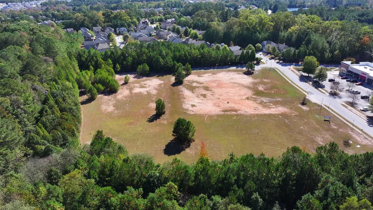 South Fulton housing development land surrounding wooded garden, lakes, townhomes and condos, Butner road, Springbox Dr, Fairburn, Atlanta, Georgia, Aerial