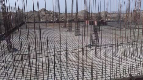 a close-up video shot of a fabricated steel reinforcement bar at the construction site. reinforcement steel of house foundation structure at the construction site. making reinforcement metal framework